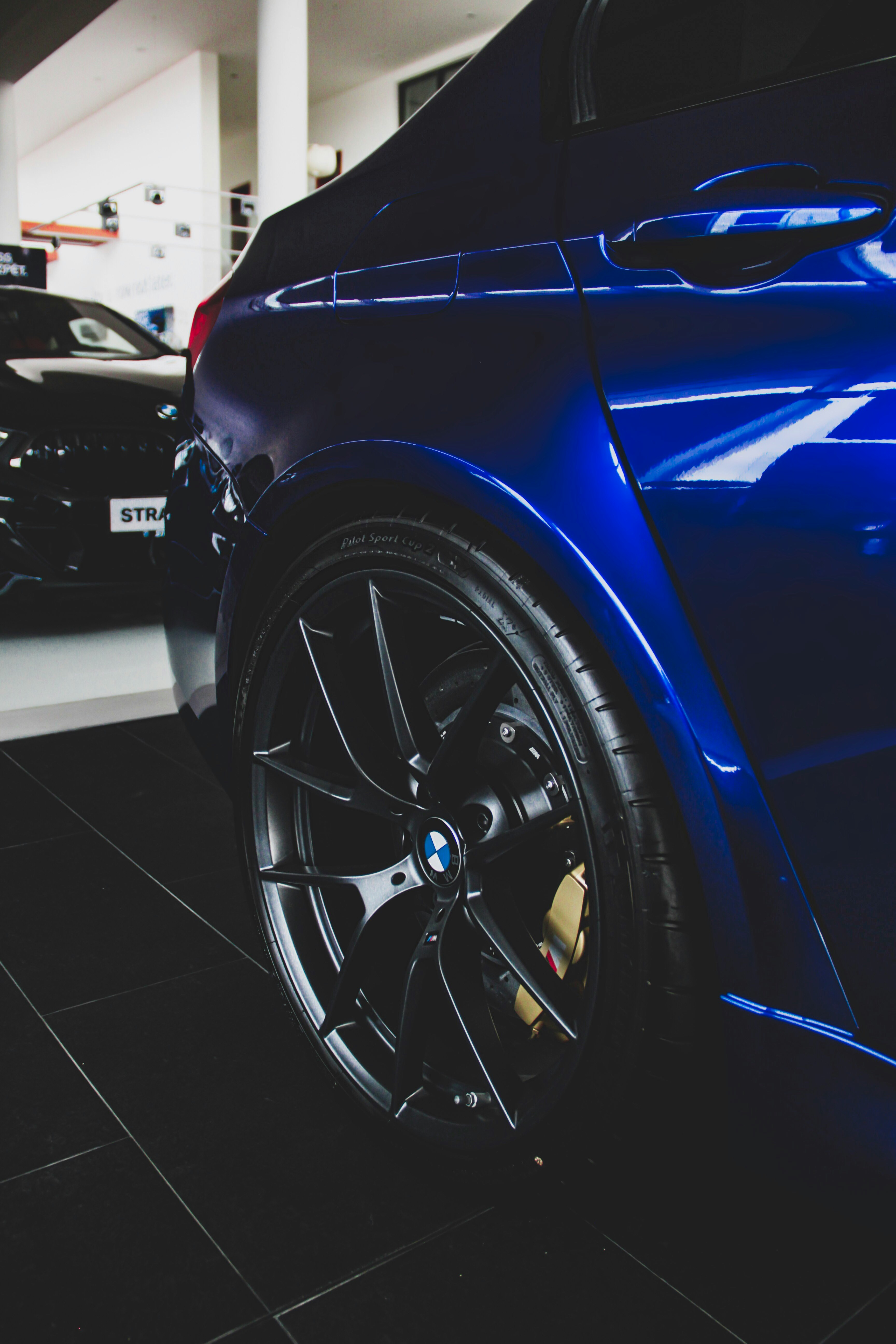 blue vehicle parks inside building